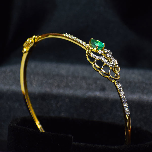 Floral pattern bracelet with green colored stone