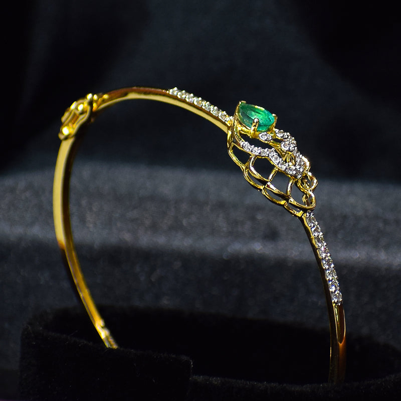 Floral pattern bracelet with green colored stone