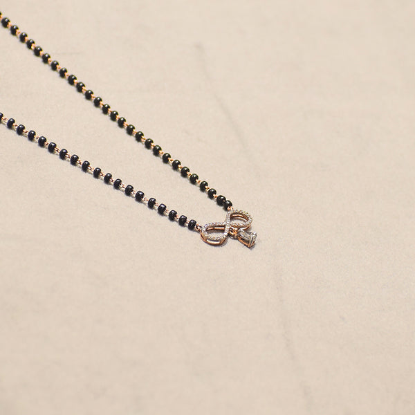 Infinity Design with Marquise Droplet Pendant With Black Beads