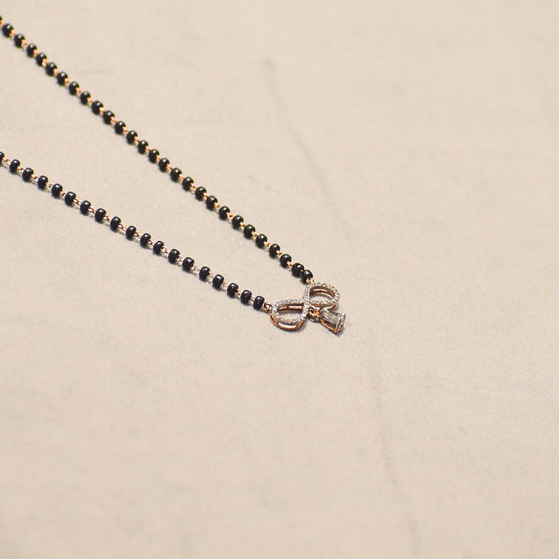 Infinity Design with Marquise Droplet Pendant With Black Beads
