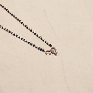 Infinity Design with Marquise Droplet Pendant With Black Beads